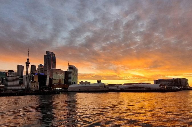 Auckland Sunset Harbour Cruise - Under the Auckland Harbour Bridge: the signature skyline moment