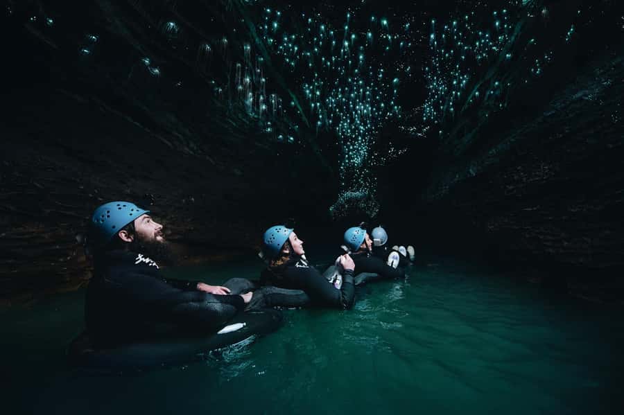 Waitomo Caves: Labyrinth Black Water Rafting Experience - Inside the Cave: Climbing, Tubing, and the Glowworm Grotto